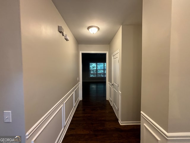 corridor with dark wood-type flooring