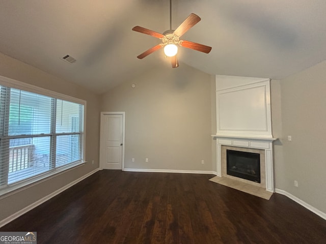 unfurnished living room with lofted ceiling, dark hardwood / wood-style floors, and ceiling fan