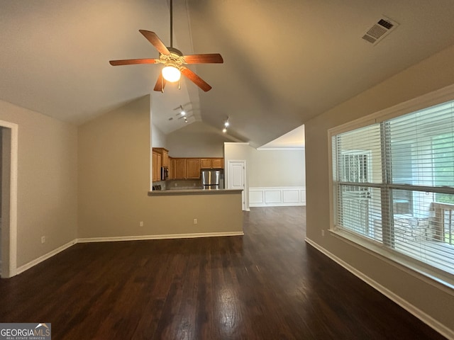 unfurnished living room featuring lofted ceiling, ceiling fan, and dark hardwood / wood-style flooring