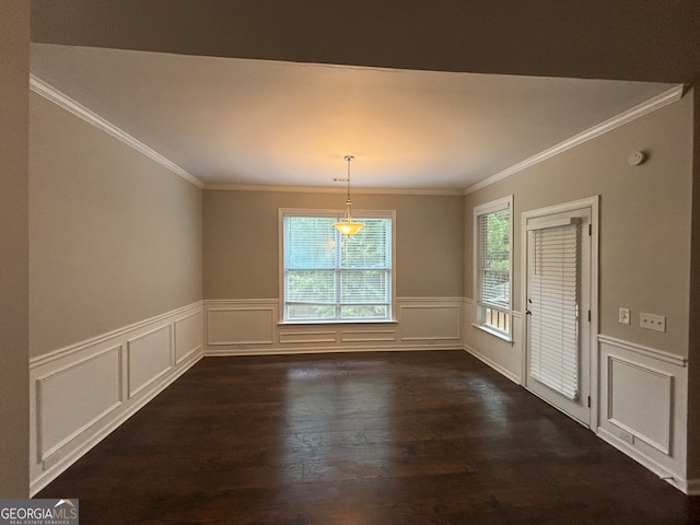 unfurnished dining area with ornamental molding and dark hardwood / wood-style flooring