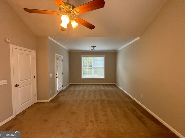 carpeted empty room with crown molding and ceiling fan