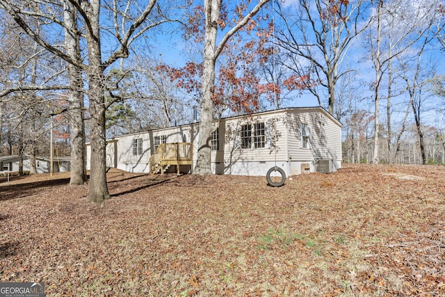 manufactured / mobile home with a wooden deck