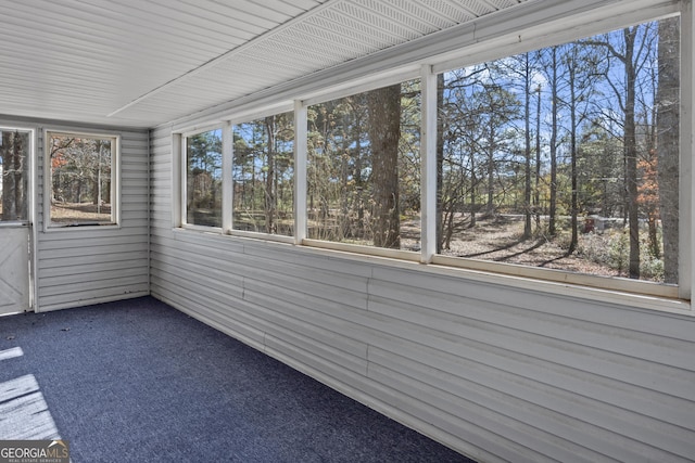 unfurnished sunroom featuring plenty of natural light