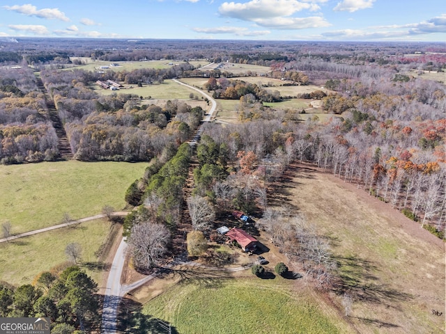 birds eye view of property with a rural view