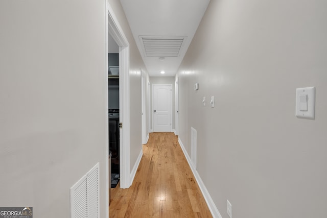 hallway featuring light hardwood / wood-style flooring