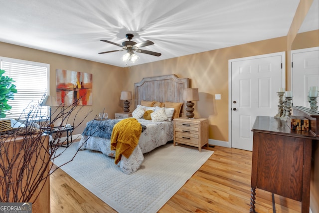 bedroom featuring light hardwood / wood-style floors and ceiling fan