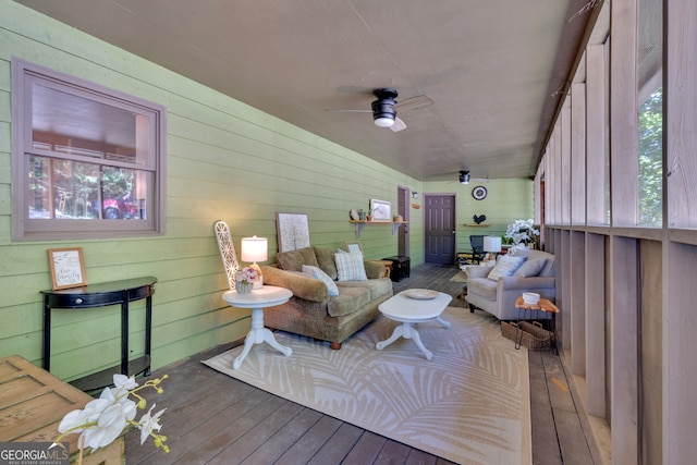 sunroom / solarium with ceiling fan