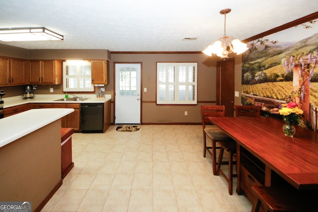 kitchen with an inviting chandelier, ornamental molding, dishwasher, pendant lighting, and sink