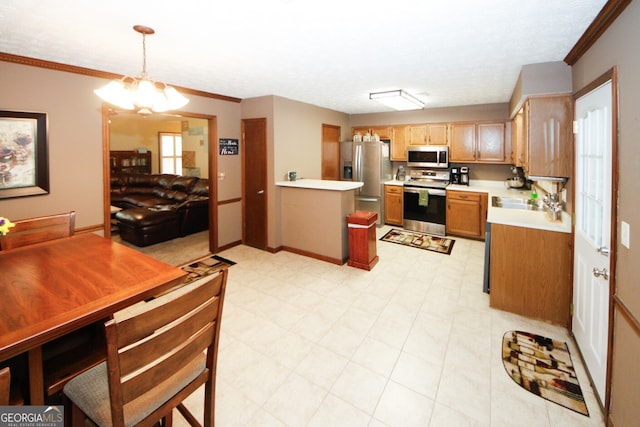 kitchen featuring sink, hanging light fixtures, stainless steel appliances, crown molding, and a chandelier