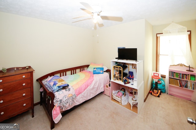 carpeted bedroom featuring ceiling fan