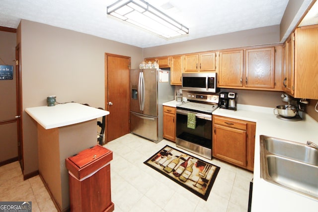 kitchen with stainless steel appliances and sink