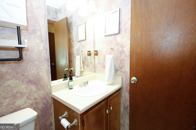 bathroom with vanity and toilet