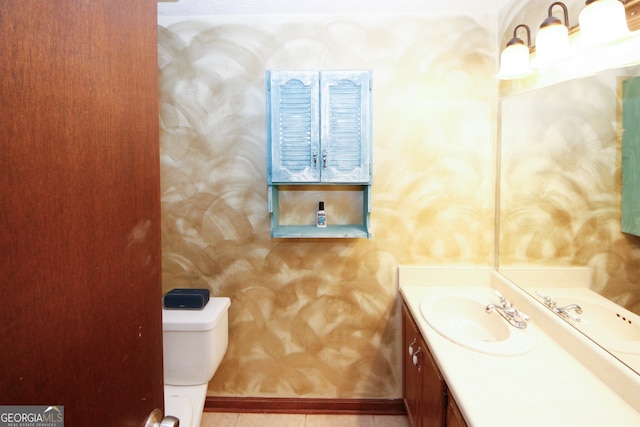 bathroom with toilet and vanity