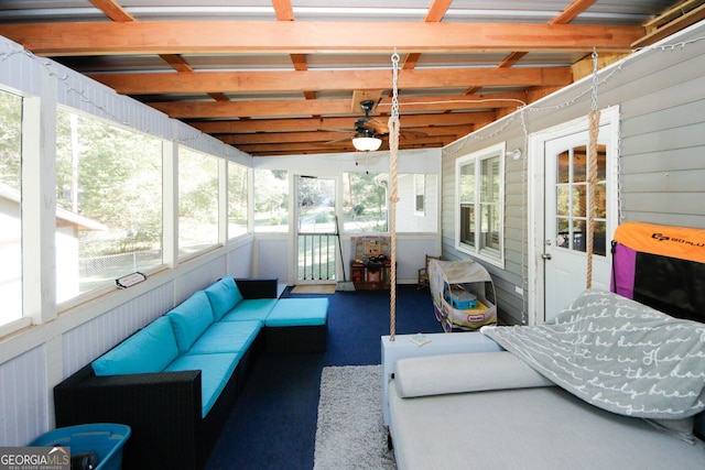 sunroom with ceiling fan and a healthy amount of sunlight