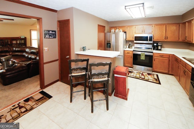 kitchen with appliances with stainless steel finishes and light tile patterned flooring