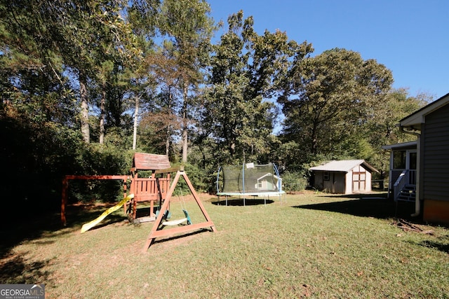 view of yard with a trampoline, a shed, and a playground