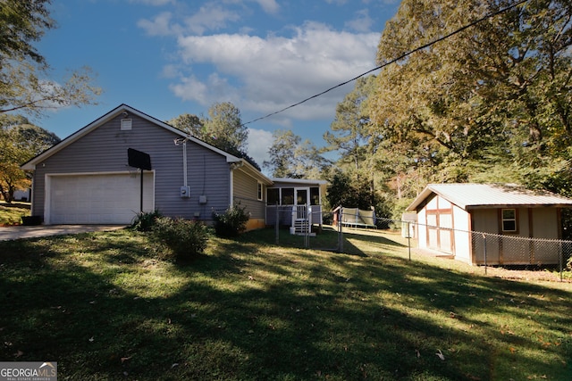 view of property exterior featuring a yard and a garage