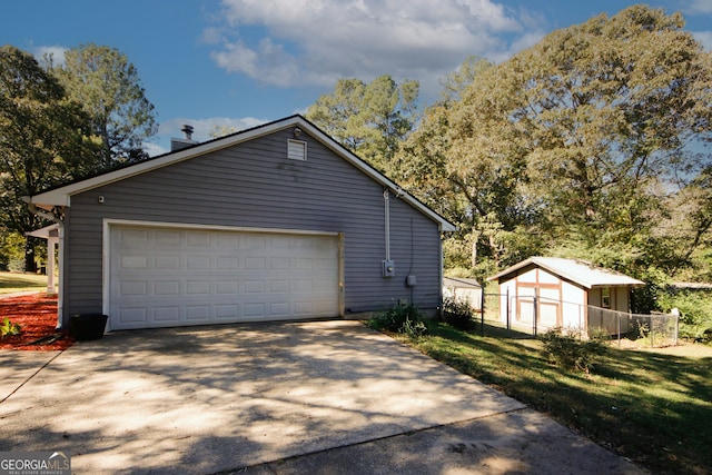 view of home's exterior with an outbuilding and a lawn