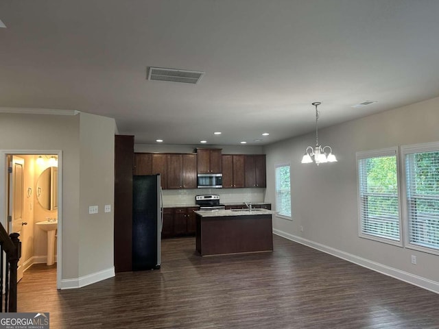 kitchen with hanging light fixtures, sink, stainless steel appliances, dark hardwood / wood-style floors, and a center island