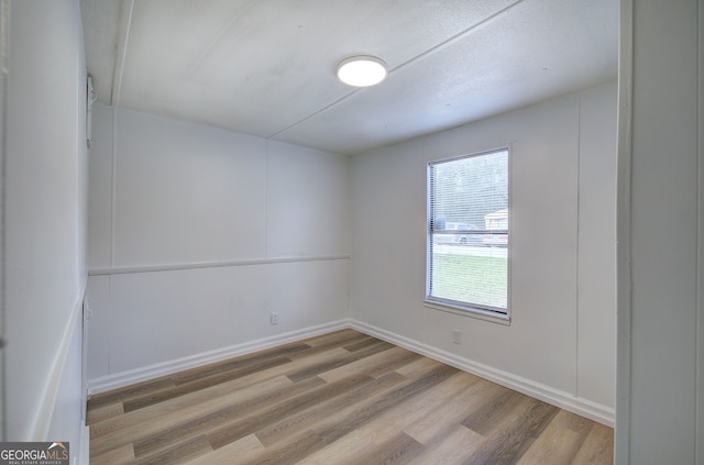 unfurnished room featuring light hardwood / wood-style floors