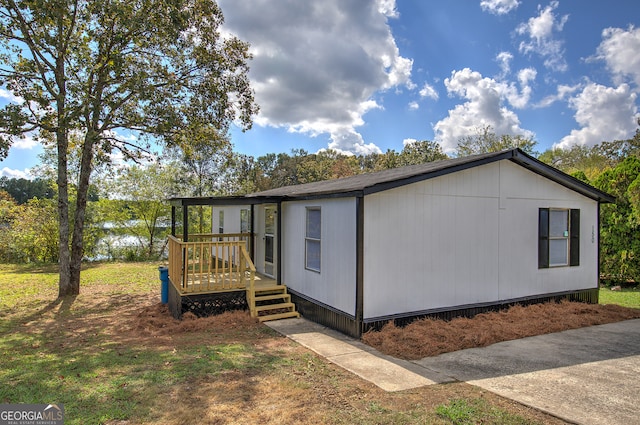 view of side of home with a deck