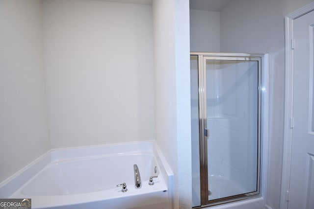 bathroom with separate shower and tub