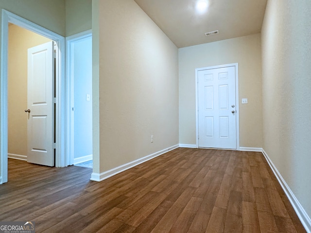 interior space with dark hardwood / wood-style flooring