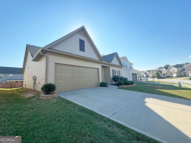 view of front facade with a garage and a front yard