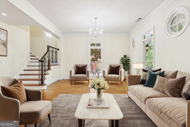 living room featuring a wealth of natural light, crown molding, and hardwood / wood-style flooring