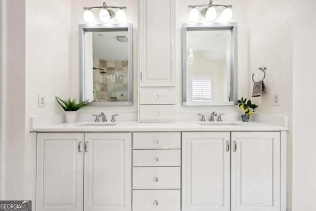 bathroom with vanity and a shower