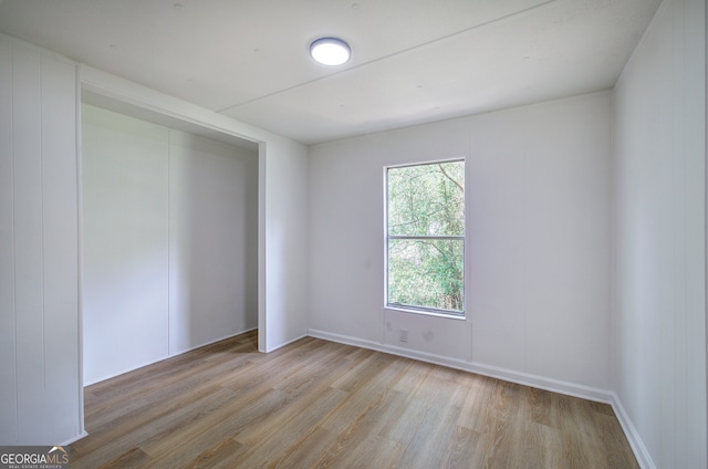 spare room with light hardwood / wood-style flooring