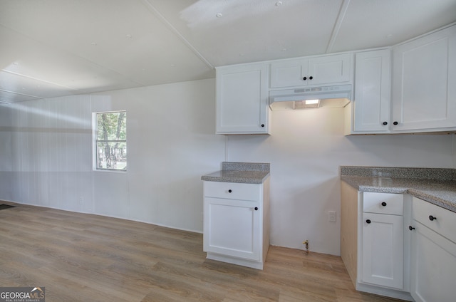 kitchen with white cabinetry and light hardwood / wood-style flooring