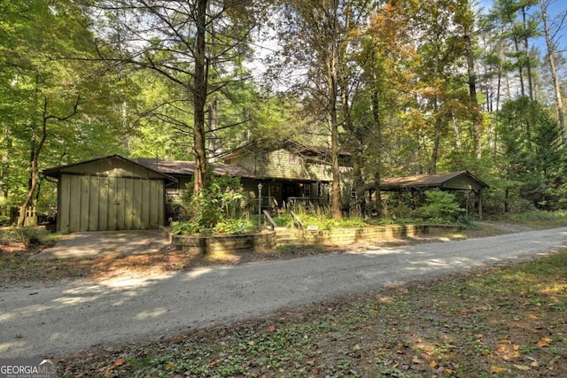 view of front of house featuring a storage unit