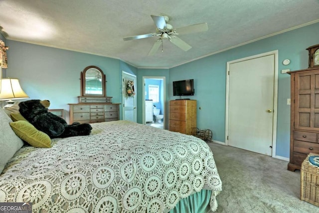 carpeted bedroom featuring a textured ceiling, crown molding, ceiling fan, and a closet