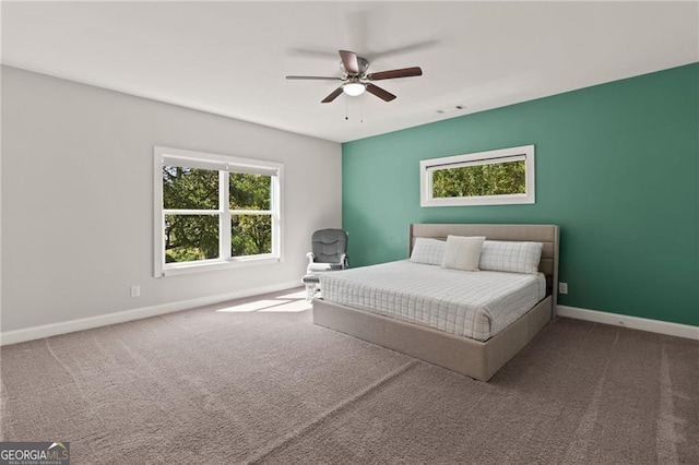 carpeted bedroom with ceiling fan