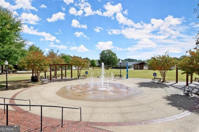 view of home's community with a yard