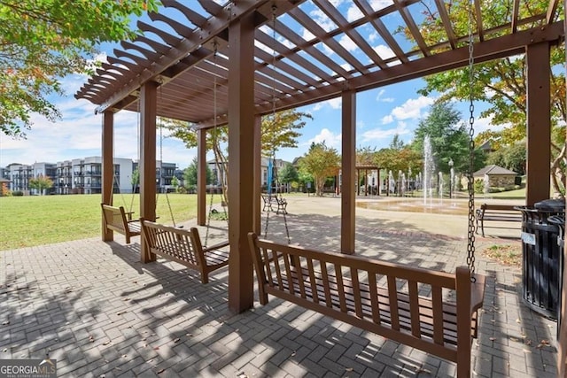 exterior space featuring a pergola, a yard, and a patio