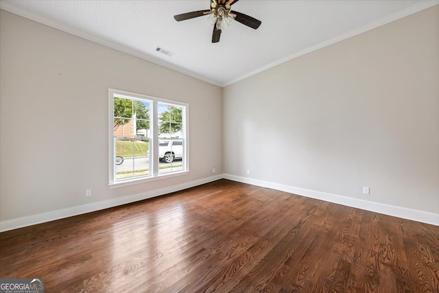 empty room featuring wood-type flooring, crown molding, and ceiling fan