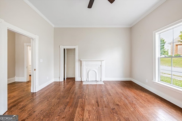 interior space with ornamental molding, dark hardwood / wood-style flooring, and plenty of natural light