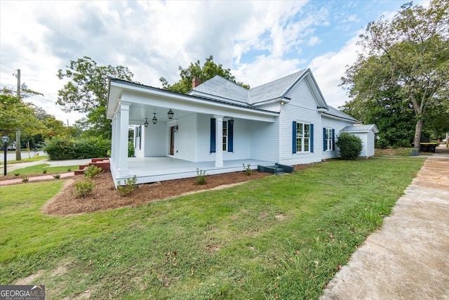 view of front of home with covered porch and a front yard