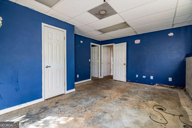 unfurnished bedroom featuring a paneled ceiling