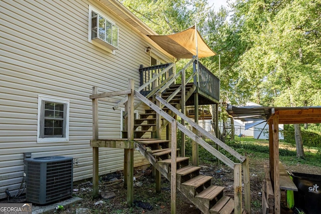 view of playground with central AC and a wooden deck