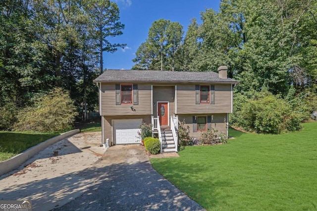 4693 Hairston Crossing Rd, Stone Mountain, GA 30083 - split foyer home featuring concrete driveway, a chimney, a front yard, and a garage