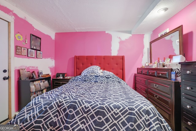 bedroom featuring a textured ceiling