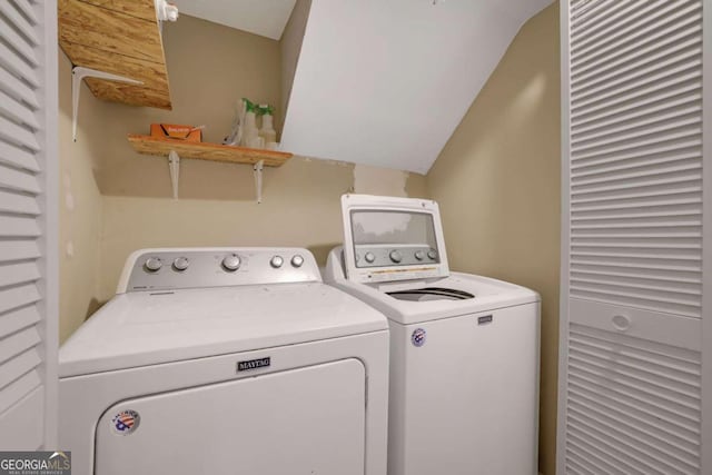 washroom featuring washer and dryer