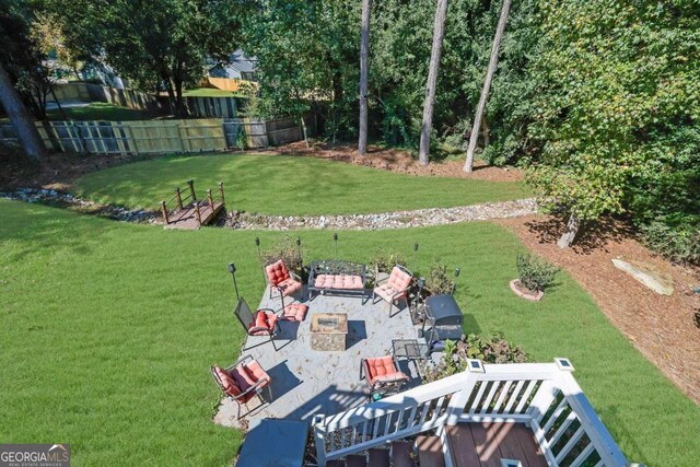 view of yard featuring a patio and an outdoor fire pit