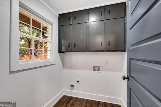 clothes washing area with dark wood-style floors, baseboards, washer hookup, cabinet space, and electric dryer hookup