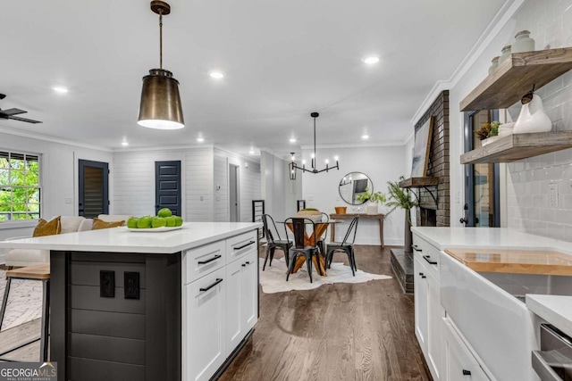 kitchen with dark wood-style flooring, open floor plan, white cabinetry, open shelves, and light countertops