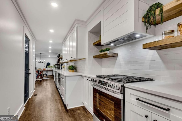 kitchen featuring open shelves, light countertops, stainless steel gas stove, and custom exhaust hood