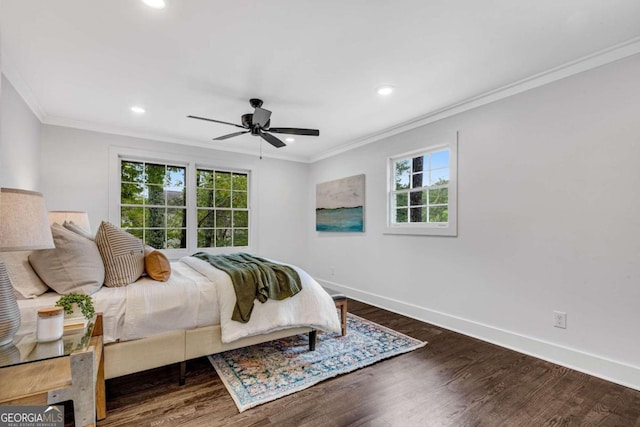 bedroom with wood finished floors, baseboards, recessed lighting, and crown molding